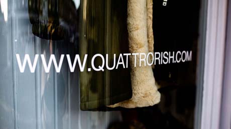 A shop window with www.quattrorish.com written on it
