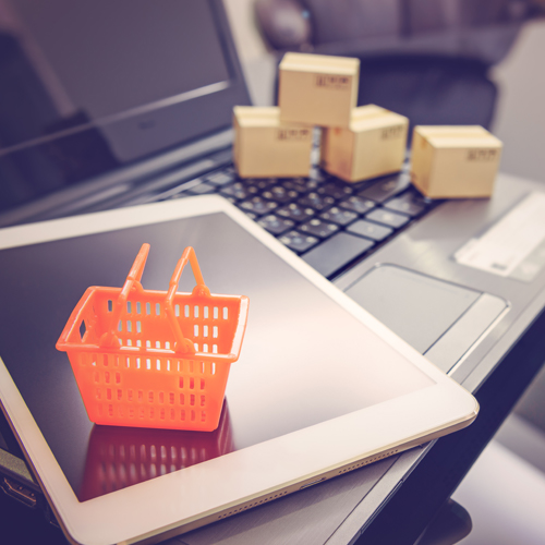 integrated multichannel eCommerce - shopping basket and boxes on latop and tablet
